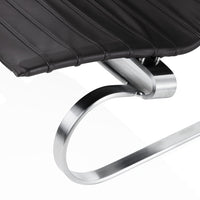 Black ribbed seat with sleek silver metal frame, featuring a minimalist design for modern interiors.