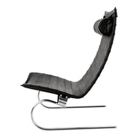 Black curved lounge chair with a smooth quilted pattern and sleek metal frame. Perfect for modern decor.
