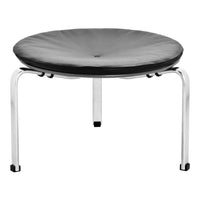 Round black cushion stool with sleek chrome legs, featuring a subtle tufted pattern for added texture.
