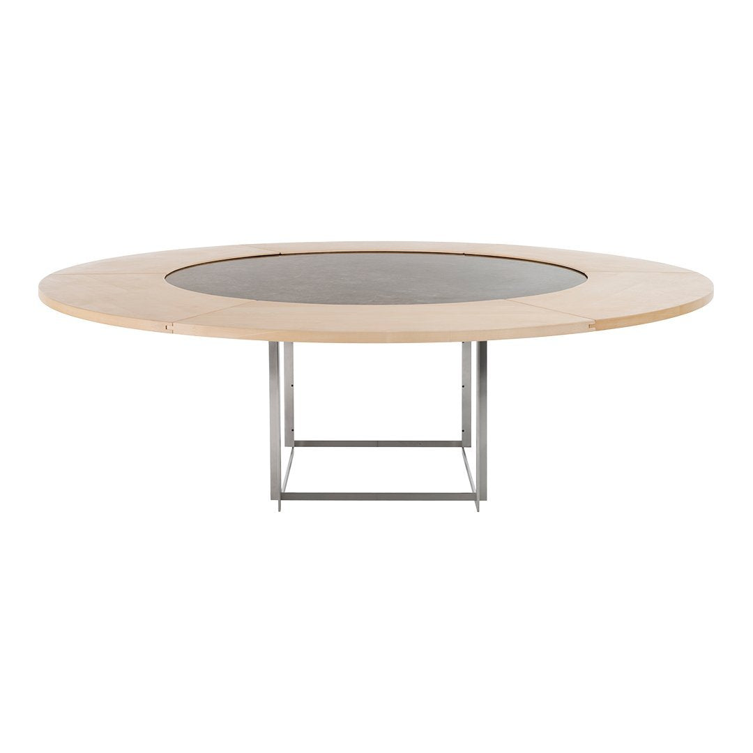 Round wooden dining table with light natural finish and a contrasting dark gray stone center. Sleek metal base.