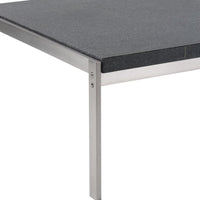 Gray stone tabletop with sleek stainless steel legs, combining modern aesthetics and durability.