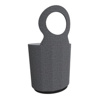 Gray fabric trash bin with a circular handle and textured pattern, perfect for modern decor.