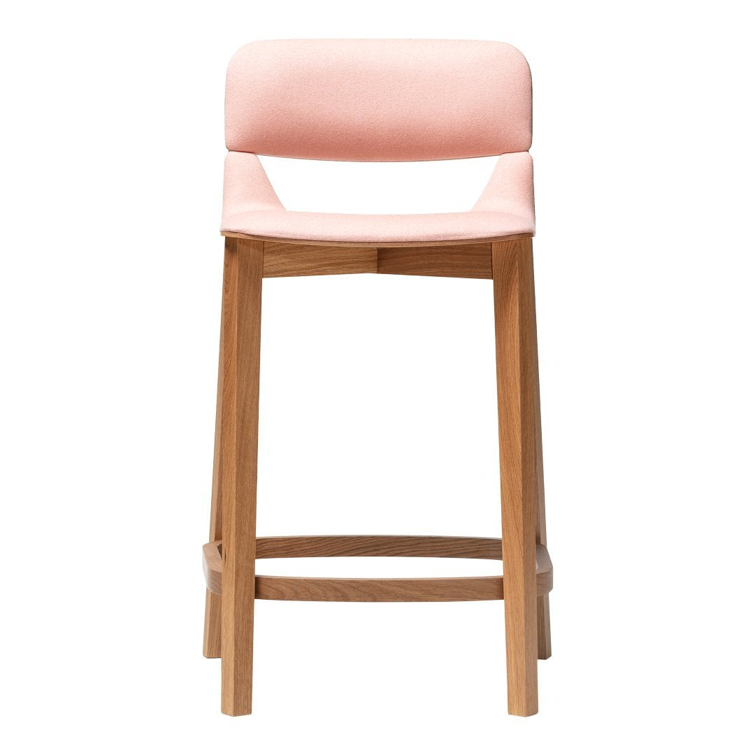 "Stylish pink upholstered bar stool with a natural wood frame, perfect for modern decor."