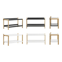 Multi-color modern shelving units featuring black and white surfaces with natural wood accents.
