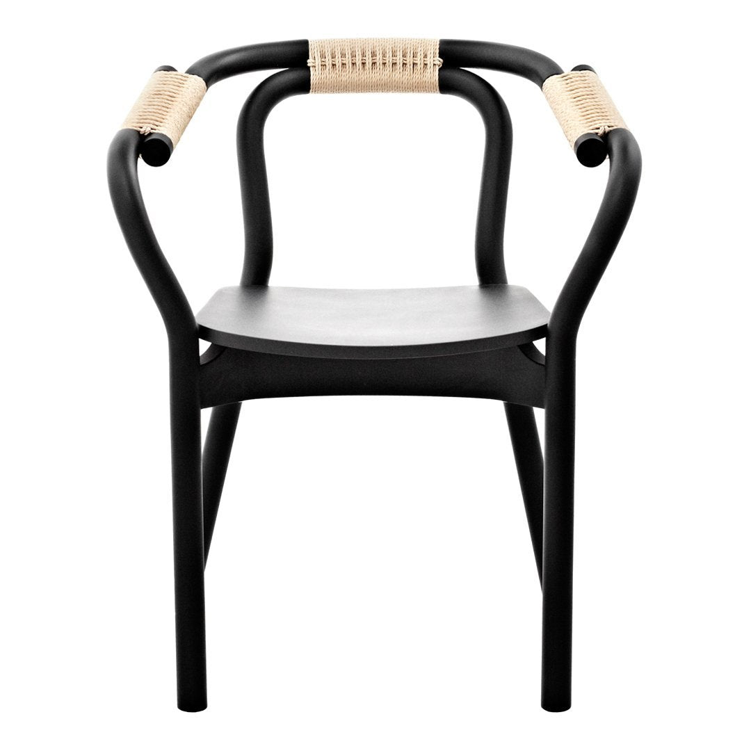 Black and natural woven chair with curved arms and a minimalist design. 