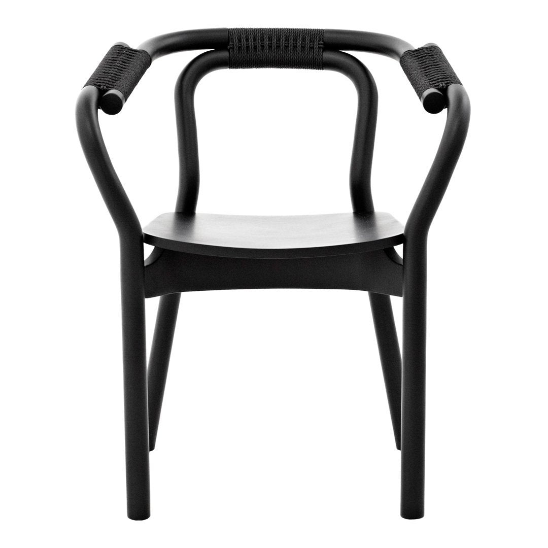 "Modern black chair with sleek lines and textured armrests, perfect for contemporary decor."