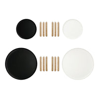 Set of black and white plates with natural wooden sticks, featuring a modern, minimalist design.