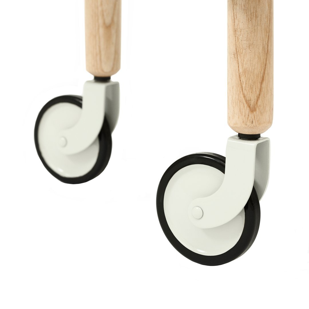 Light gray and black wheels with natural wood handles, showcasing a sleek, modern design suitable for various furniture pieces.