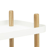 White tray table with natural wood legs, featuring a minimalist design and smooth surfaces. Ideal for modern decor.