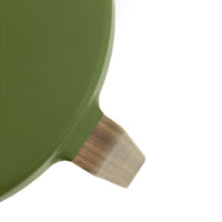 Olive green round serving tray with a natural wooden handle for a modern, stylish look.