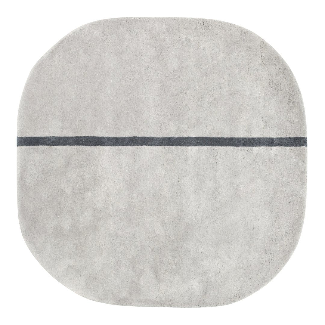 Soft gray round rug with a subtle texture and a dark gray horizontal line pattern. Perfect for modern decor.