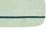 Soft mint green surface with a dark green stripe pattern. Ideal for a calming aesthetic in home decor.