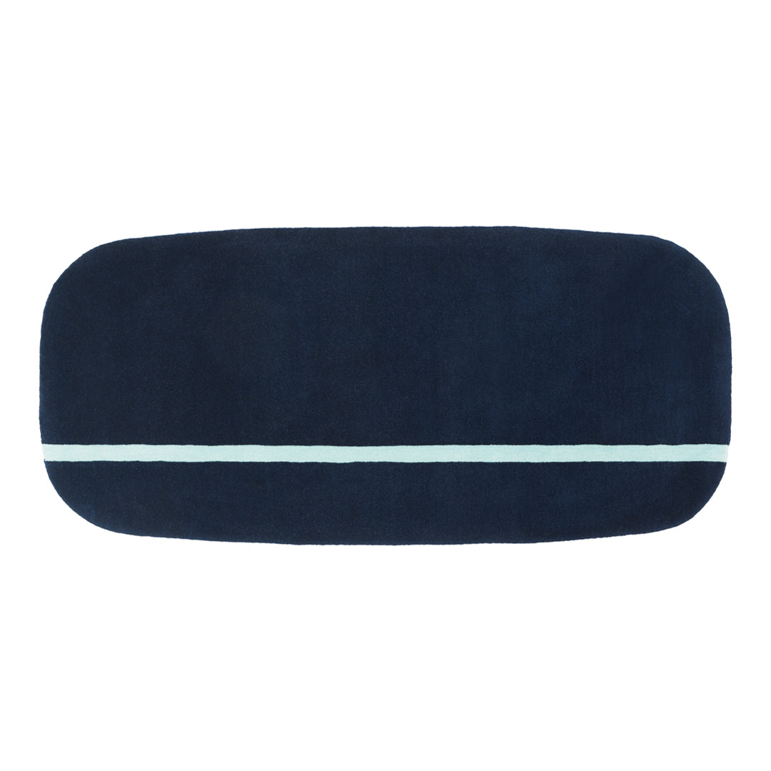 Navy blue rectangular mat with a light blue stripe across the center, featuring a soft, plush texture.