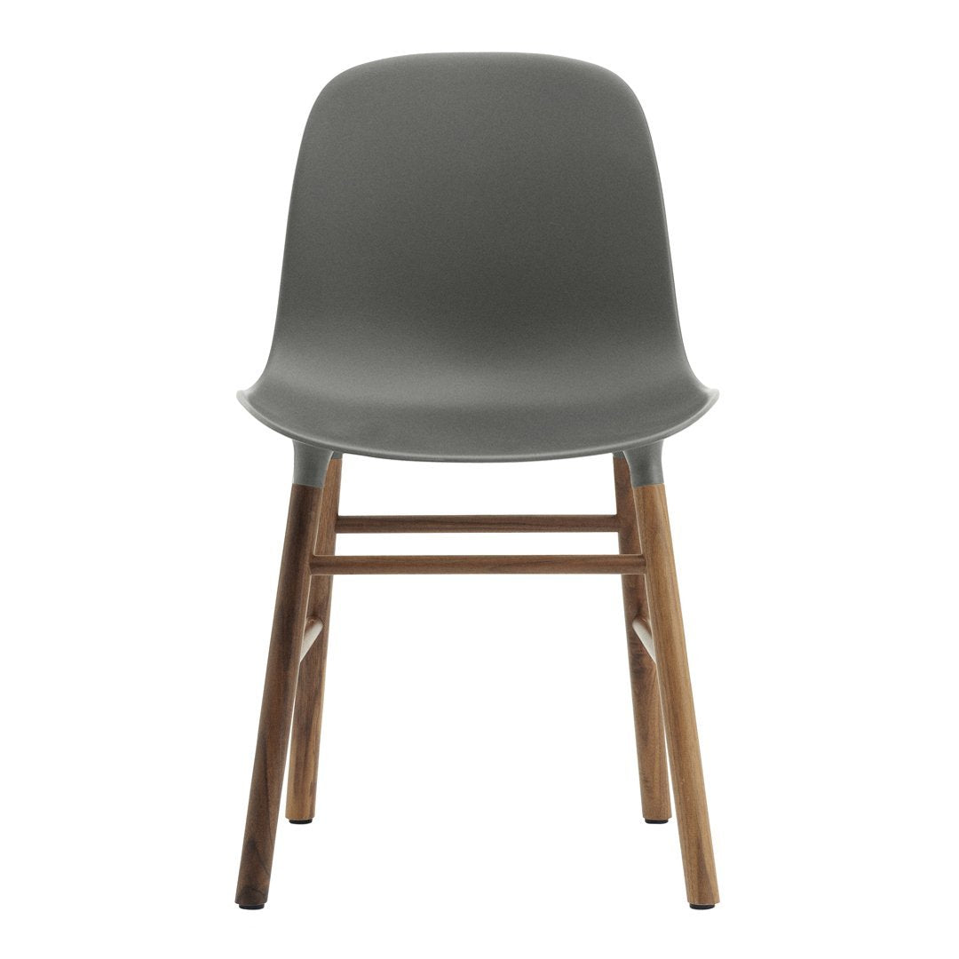 Gray plastic chair with a smooth finish and natural wood legs, featuring a minimalist design.