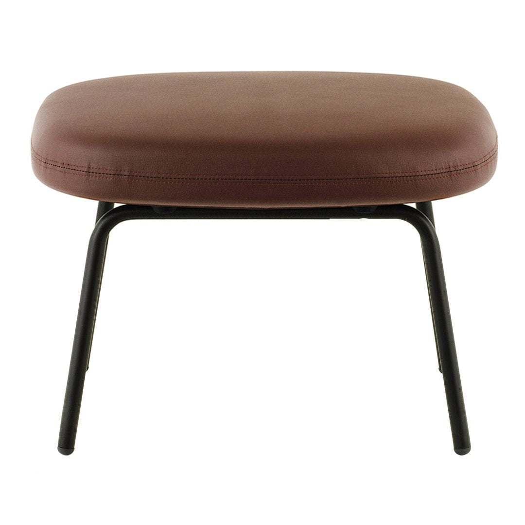 Brown cushioned ottoman with a smooth surface and sleek black metal legs, perfect for modern decor.