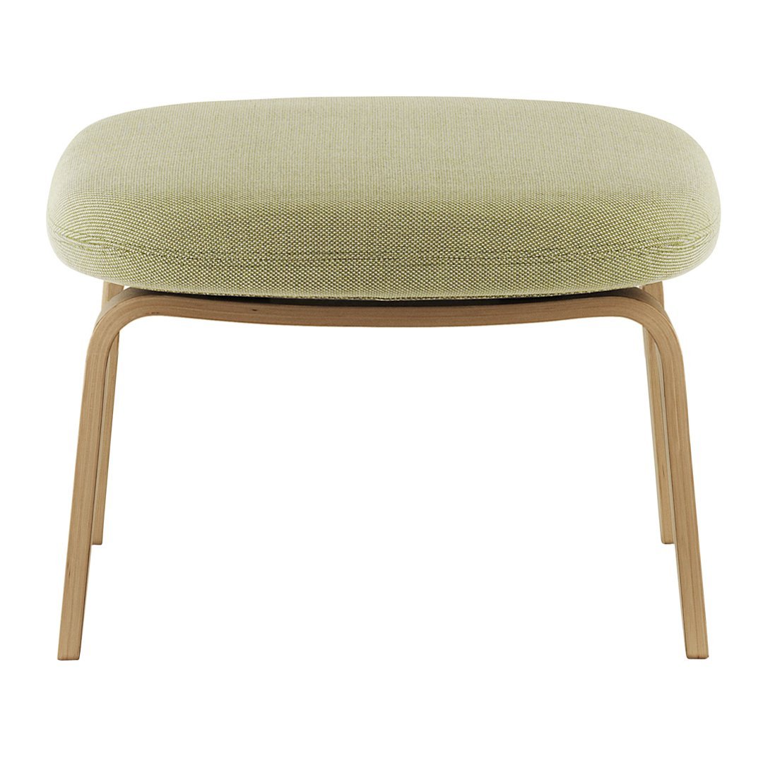 Light green upholstered ottoman with a smooth texture and natural wood legs, enhancing modern decor.