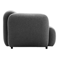 Gray upholstered armchair with a minimalist design and smooth, rounded edges. Modern texture and neutral color.