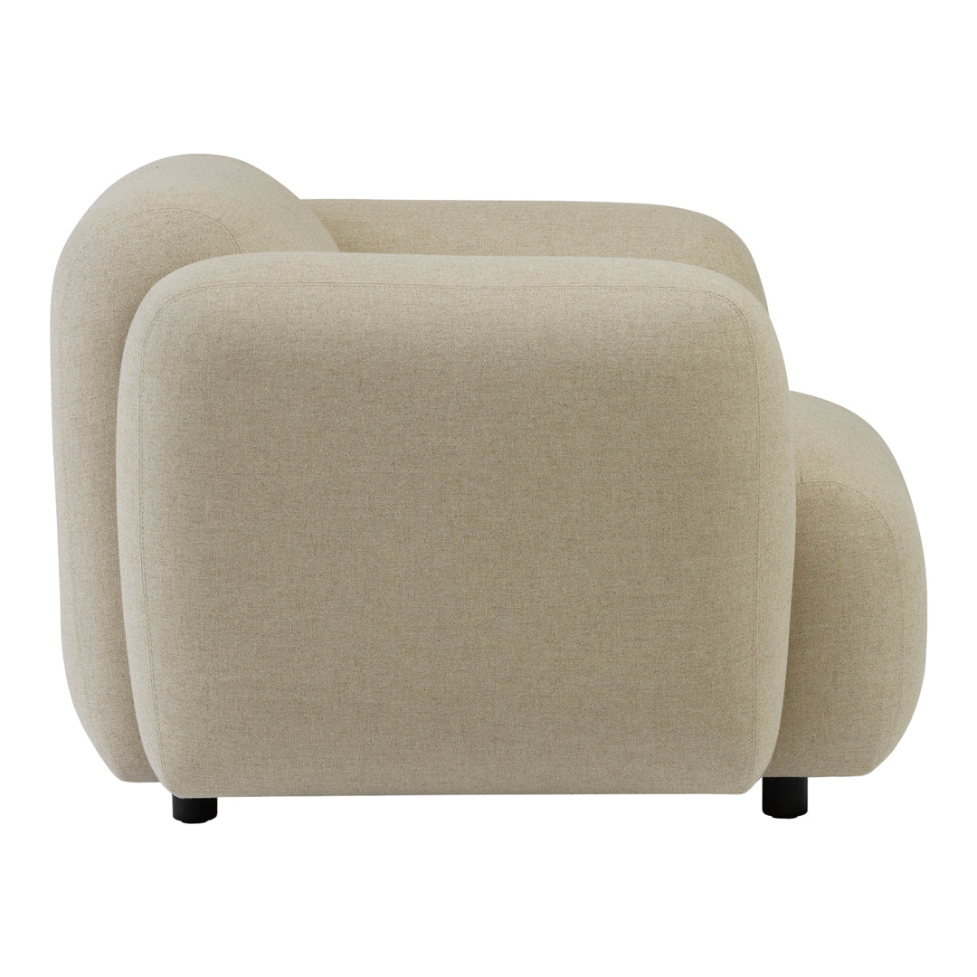 Beige armchair with a smooth, minimalist design and rounded edges, featuring a soft fabric texture.
