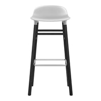 Modern white bar stool with sleek black legs and minimalist design. Perfect for contemporary interiors.