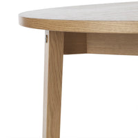 Light oak wood table with a smooth, natural finish and curved edges, showcasing a minimalist design.