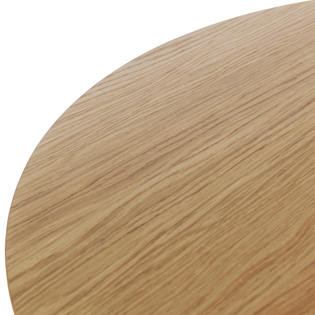Light oak wood surface with a smooth, natural grain pattern, featuring warm beige and golden tones.