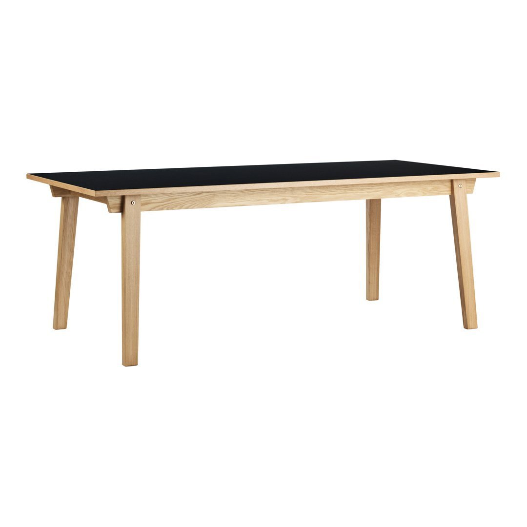 Modern wooden table with a stylish black top and light wood legs, perfect for any contemporary decor.