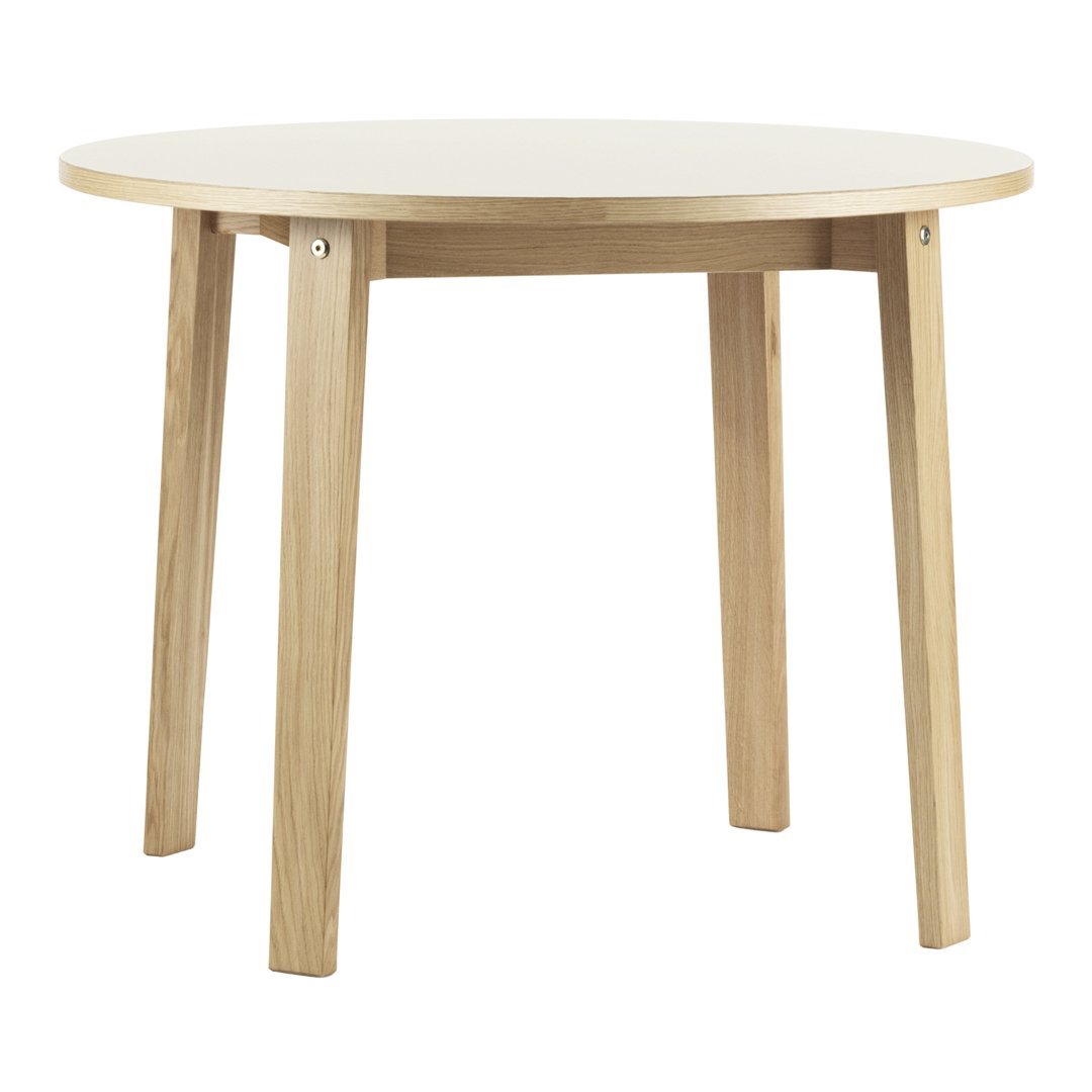 Round table with a smooth white top and natural wood legs, featuring a minimalist design. Ideal for modern interiors.