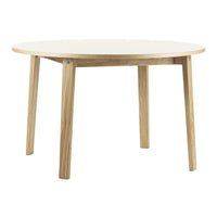Round white tabletop with natural wood legs, featuring a minimalistic design for modern interiors.