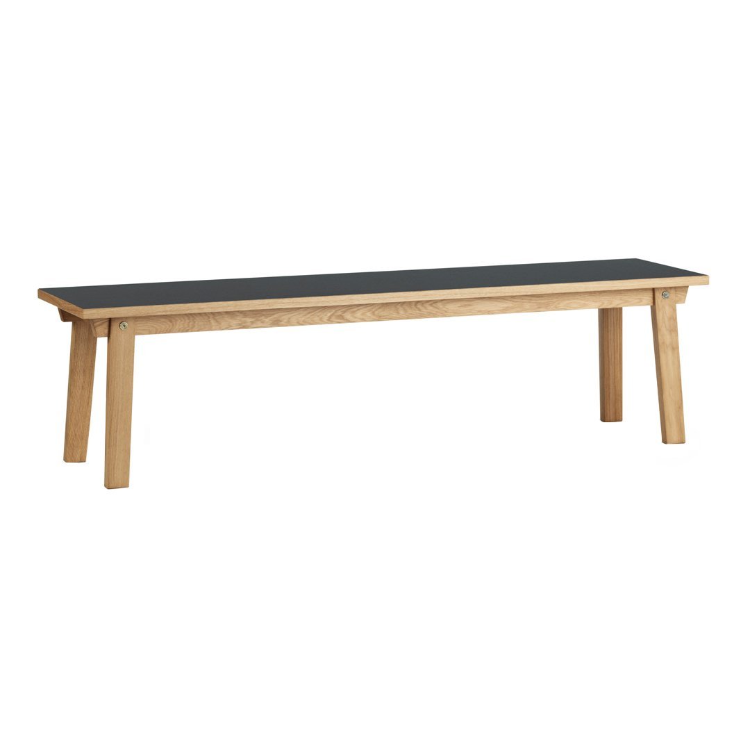Natural wood bench with a sleek black top, showcasing a minimalist design and modern color contrast.