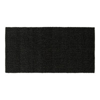Black textured doormat with a subtle pattern, ideal for entryways and enhancing home decor.