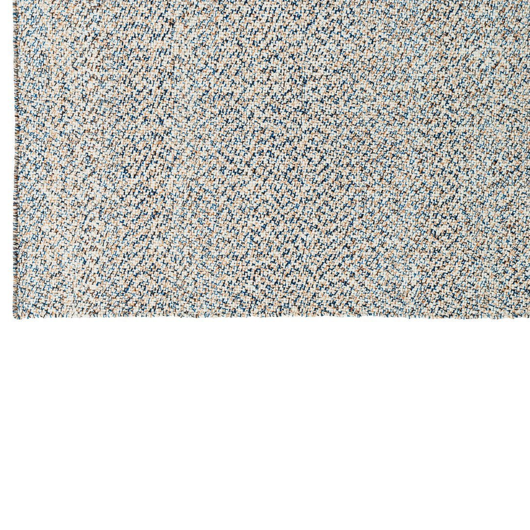 Textured rug featuring a blend of soft blues, cream, and sandy hues in a subtle pattern. Perfect for modern decor.