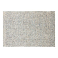 Textured rug featuring a soft gray hue with subtle specks of blue and beige, creating a calming neutral palette.