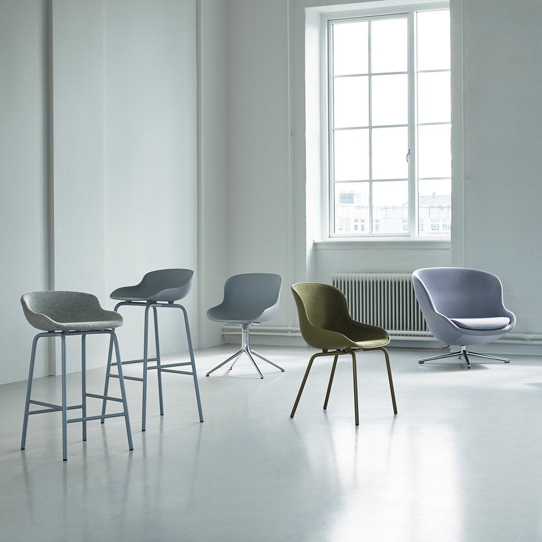 Modern chair collection featuring soft gray, olive green, and light purple tones in minimalist design.