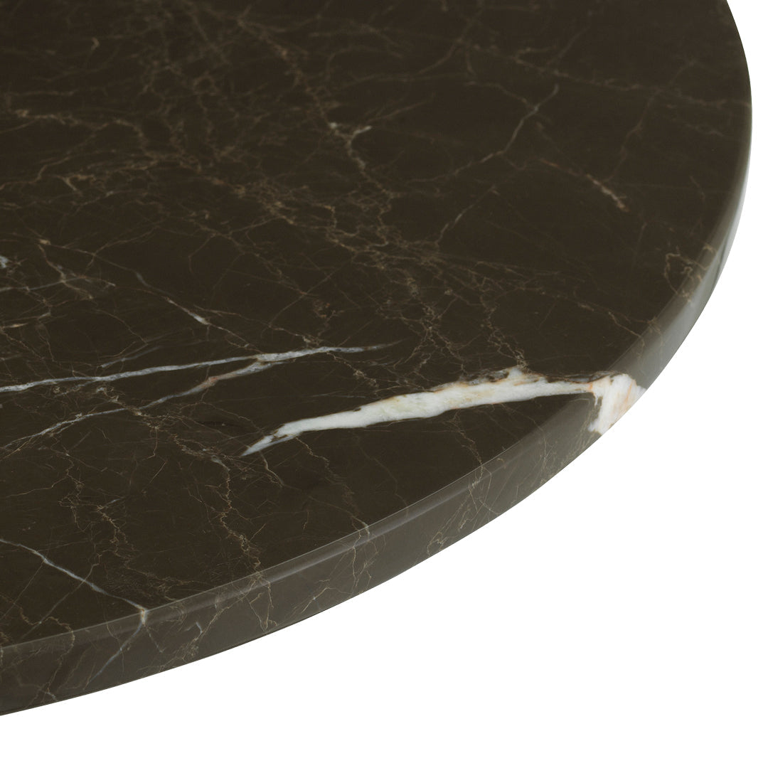 Dark marble tabletop with elegant white veins and subtle metallic flecks, showcasing a luxurious, polished finish.