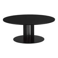 Sleek black round dining table with a smooth surface and minimalist base design. Perfect for modern interiors.