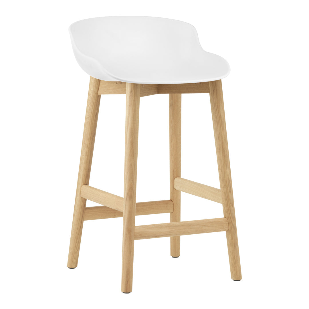 White modern bar stool with a smooth curved seat and natural wood legs. Perfect blend of style and minimalism.