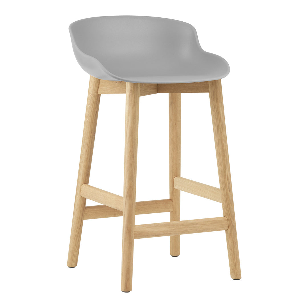 Gray plastic bar stool with a sleek, modern design and natural wooden legs, perfect for contemporary decor.