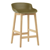 Olive green plastic seat bar stool with natural wood legs, minimalistic design ideal for modern decor.