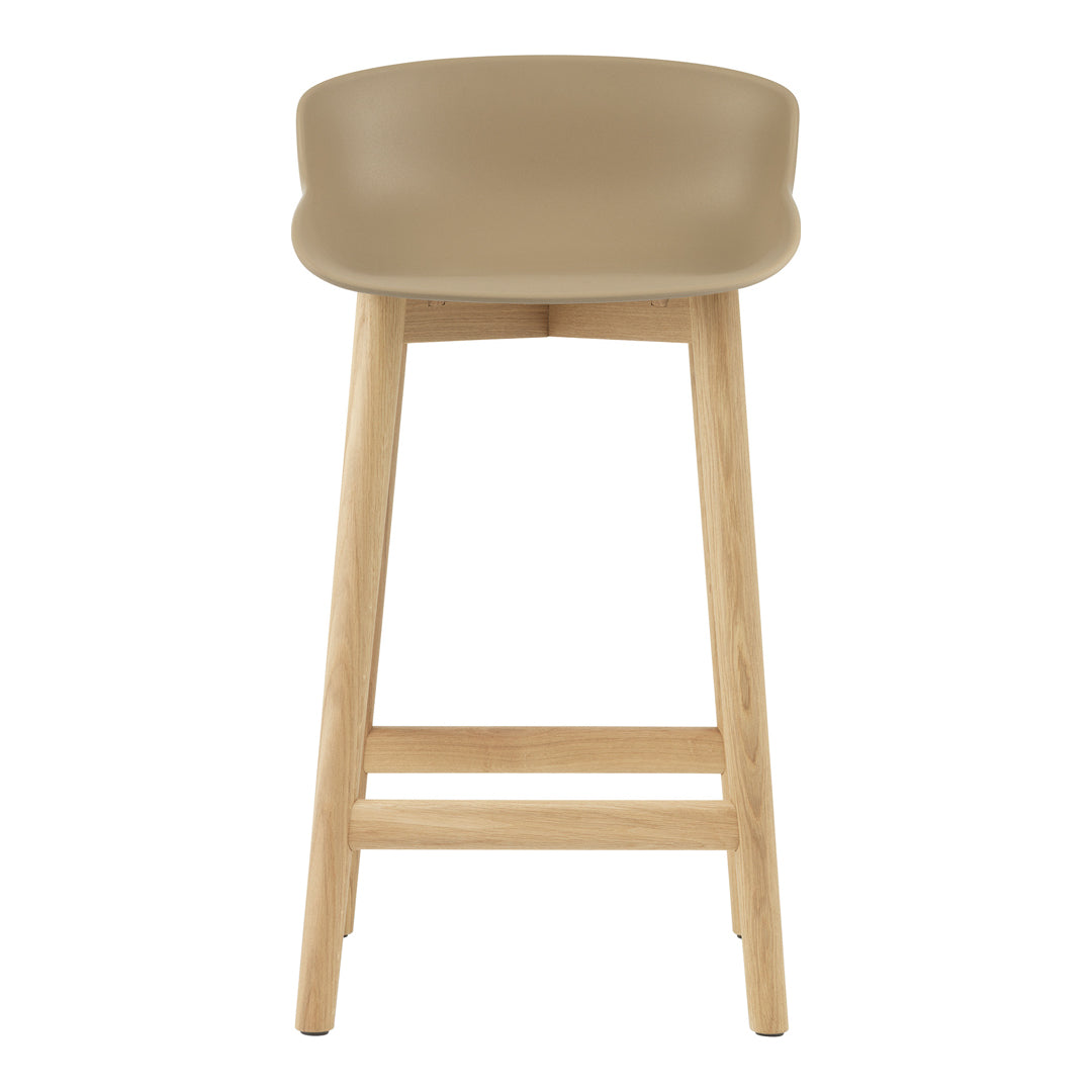 Tan modern bar stool with a minimalist design and light wood legs. Perfect for contemporary interiors.