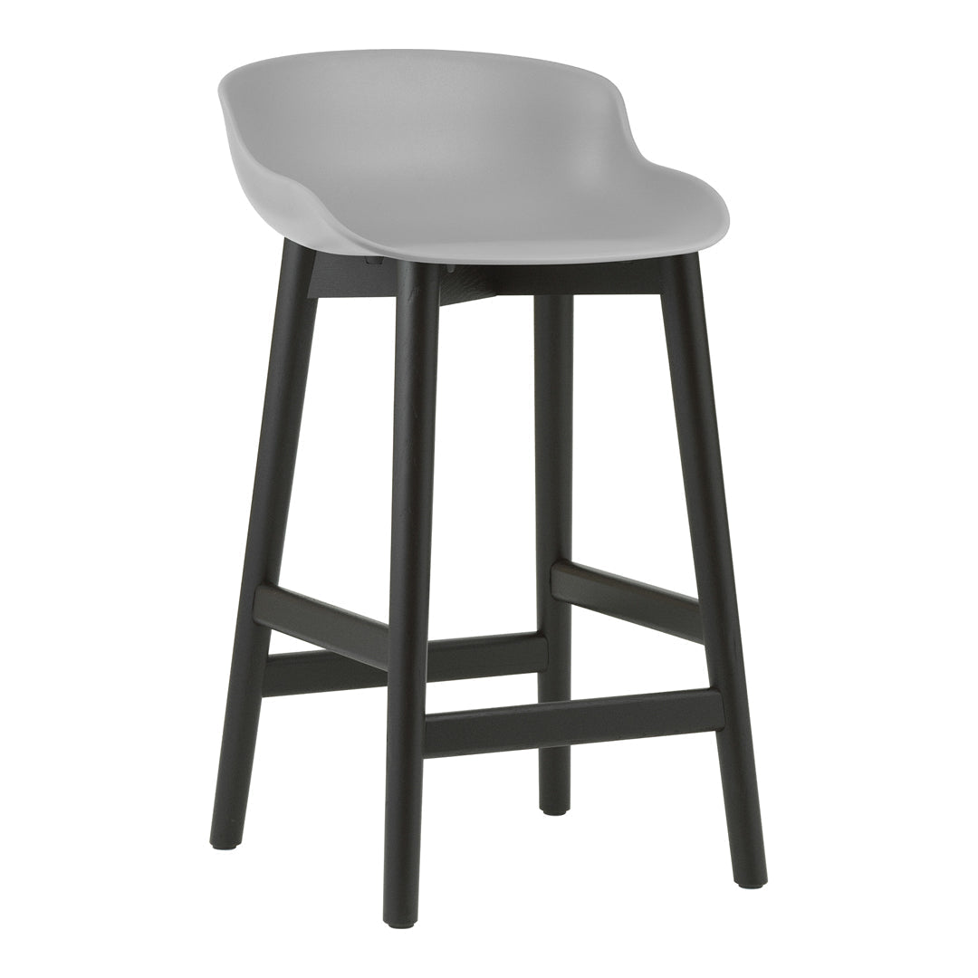 Modern gray bar stool with a sleek curved seat and black wooden legs. Minimalist design and neutral color palette.