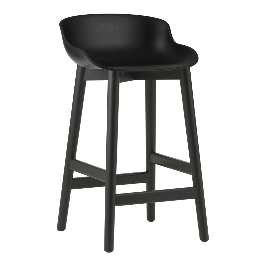 Black bar stool with smooth curved seat and sturdy wooden legs, featuring a modern, minimalist design.