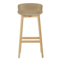 Beige bar stool with a smooth curved seat and natural wood legs. Minimalist design and neutral color palette.