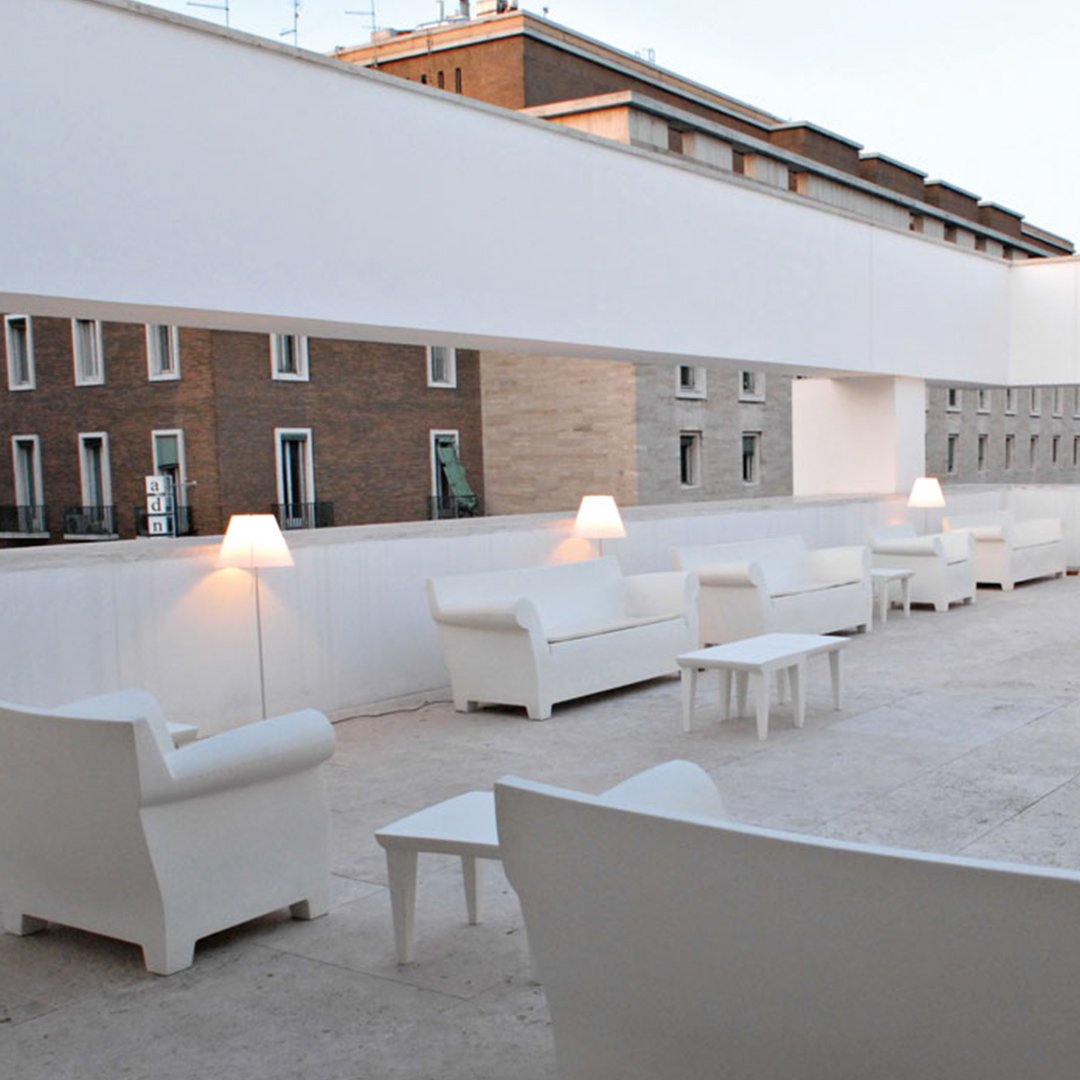 "Modern white outdoor seating set with sleek lines and minimalistic design, ideal for stylish patios."