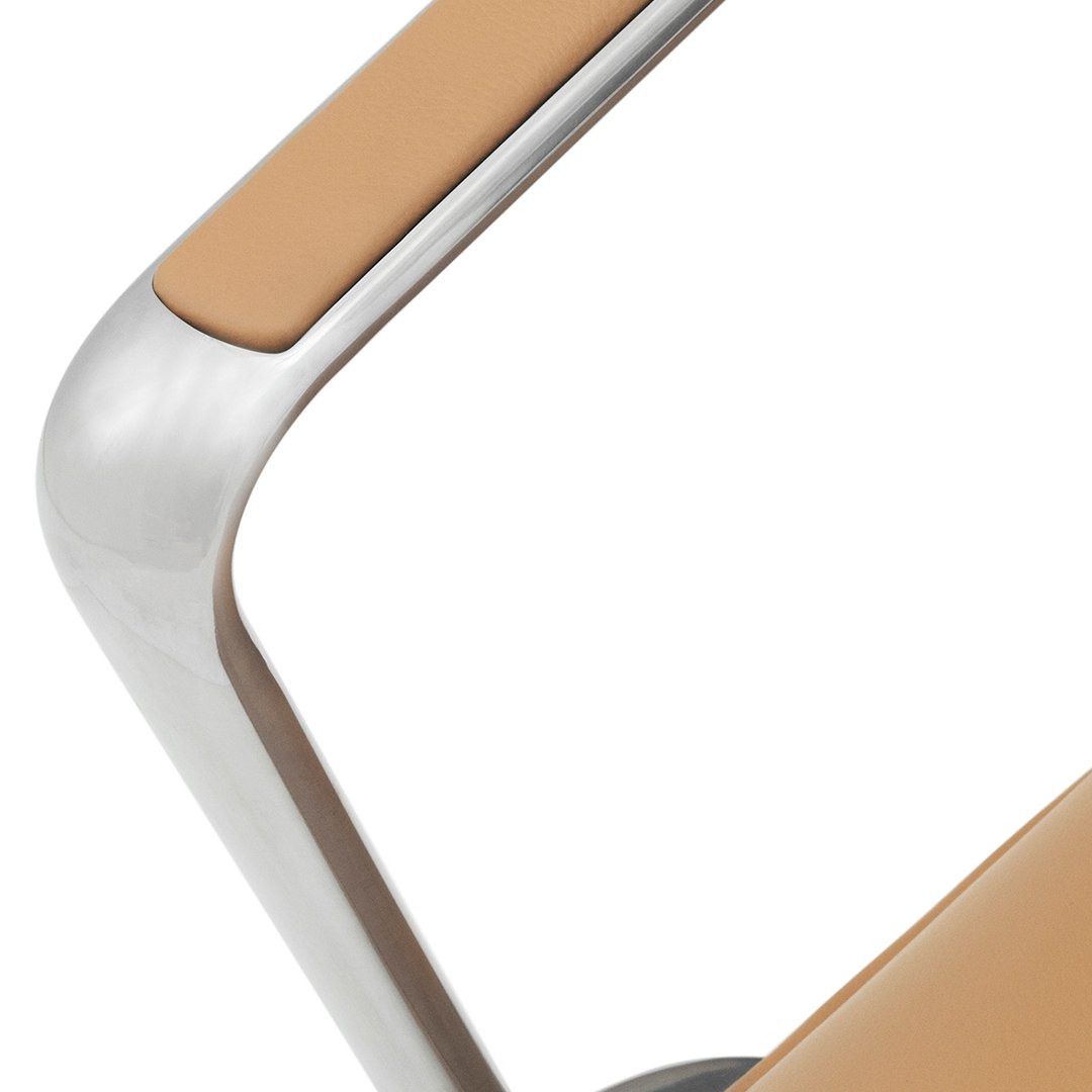 Stylish tan armrest with sleek metallic details, featuring a modern minimalistic design. Perfect for contemporary decor.