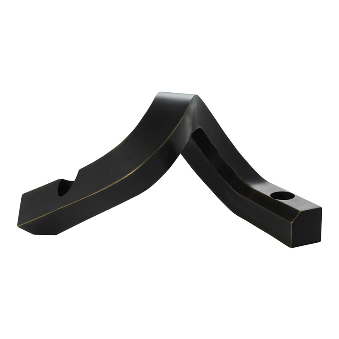Black geometric design with smooth curves and sharp edges, featuring subtle gold accent lines.