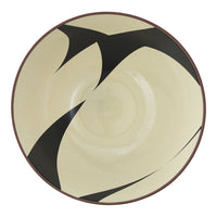 Beige plate featuring bold black abstract patterns, ideal for modern table settings.
