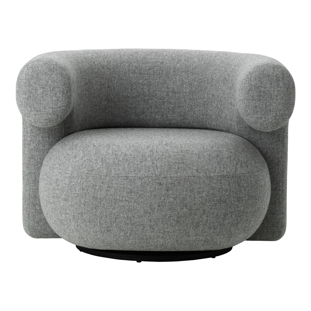 Gray plush armchair with rounded shapes and a minimalist design, featuring a soft fabric texture.