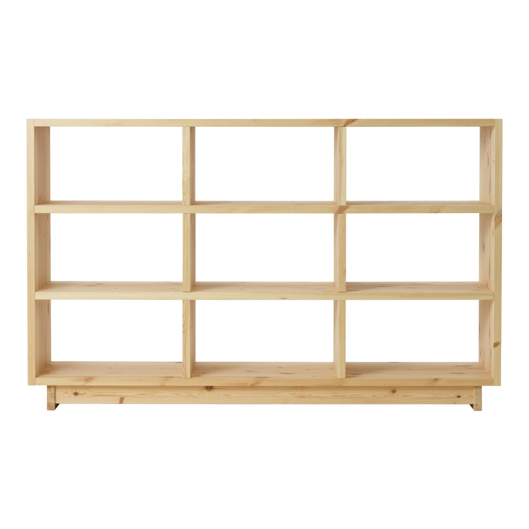 Light natural wood bookshelf with a minimalist design and open shelving in a simple, unadorned pattern.