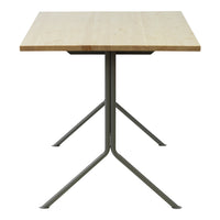 Natural wood grain tabletop with a light finish on a sleek gray metal base. Modern, minimalist design.
