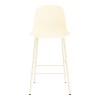 "Minimalist cream bar stool with sleek white legs, featuring a smooth, curved seat design."